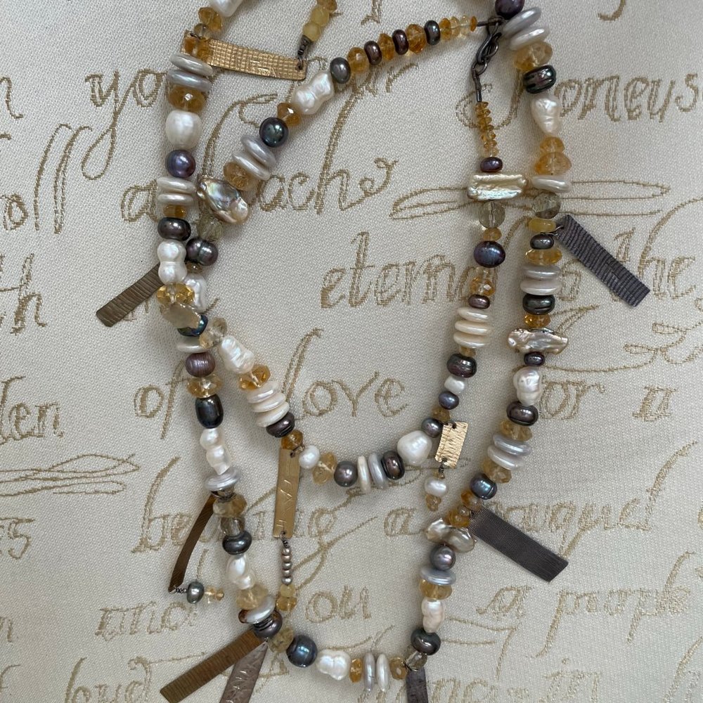 Hand-crafted necklace with fresh water pearls and metals